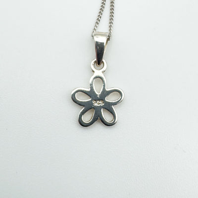 Reverse of sterling silver flower pendant stamped 925.