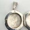 Close-up of 925 stamp inside sterling silver locket