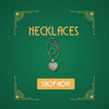 White gold pavé heart necklace on green background with art deco corners and Shop Now button